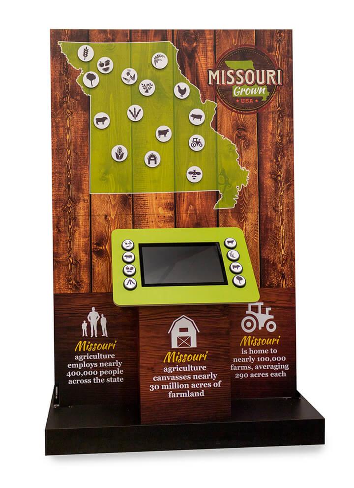 A standup display, showing magnetic map and video monitor, designed to educate consumers about the crop diversity of a given state