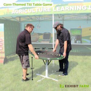 Two men playing the corn maze tilt table game