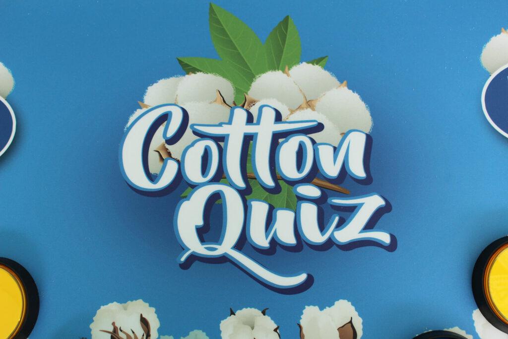 White letters spelling "Cotton Quiz" on a blue background. Part of an educational trivia game about cotton.